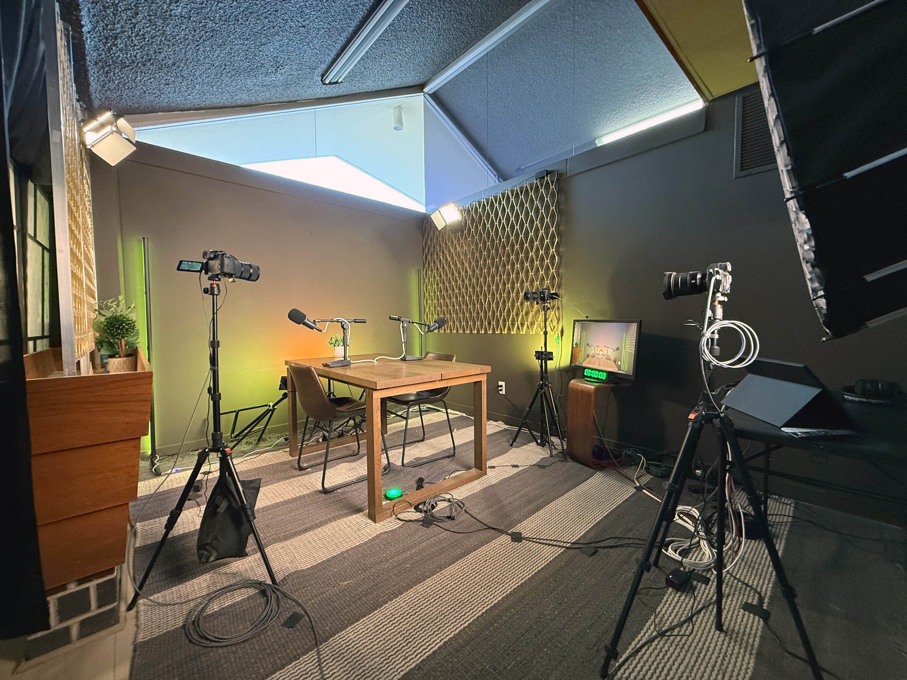 KillerGrowth podcast studio control desk with RodeCaster Video, cameras, and headphones